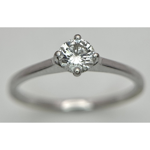 384 - An 18K White Gold Diamond Solitaire Ring. 0.31ct round brilliant cut diamond with E colour and VS1 c... 
