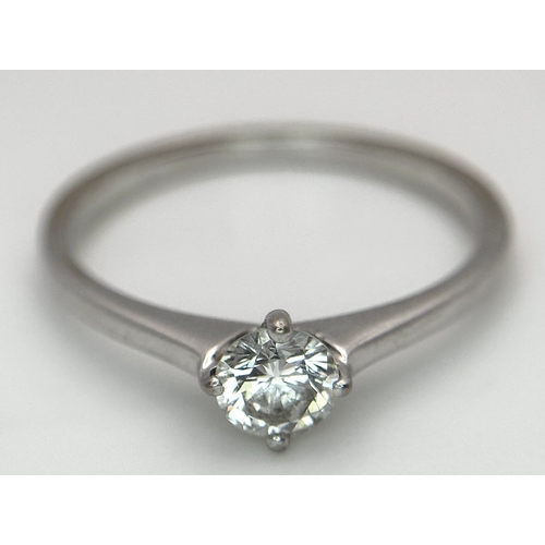 384 - An 18K White Gold Diamond Solitaire Ring. 0.31ct round brilliant cut diamond with E colour and VS1 c... 