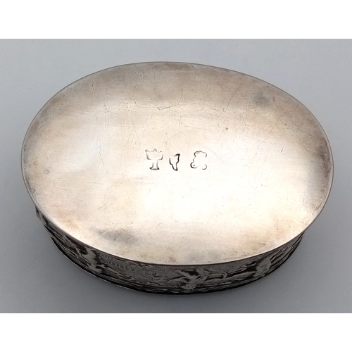 396 - An Antique Silver (800 Purity) German/Dutch Trinket Box. Repoussé decorative work of children playin... 