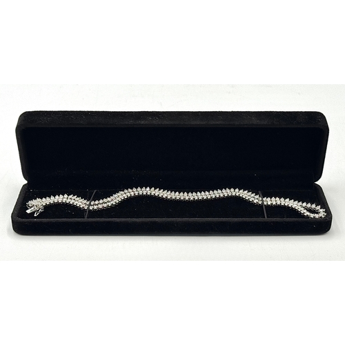 8 - An 18K White Gold Diamond Tennis Necklace. 10ctw of round brilliant cut diamonds. G-H colour. SI1/2 ... 