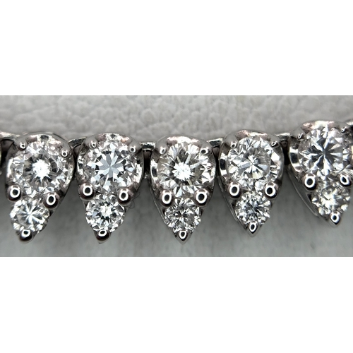 8 - An 18K White Gold Diamond Tennis Necklace. 10ctw of round brilliant cut diamonds. G-H colour. SI1/2 ... 