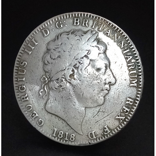 122 - An 1818 George III Silver Crown Coin. LIX. VF+ but please refer to photos.