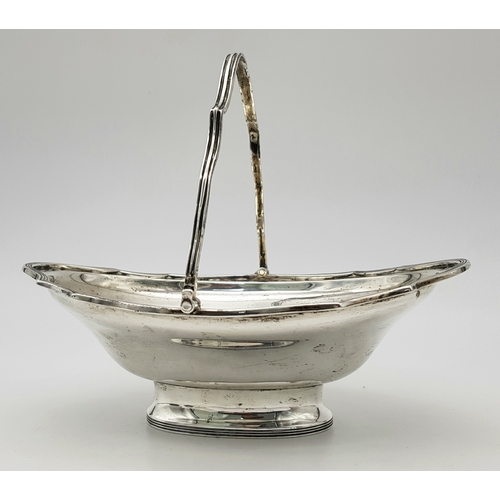 136 - An Antique Sterling Silver Serving Basket with Swing Handle.
Hallmarks for London 1907. 19cm length ... 
