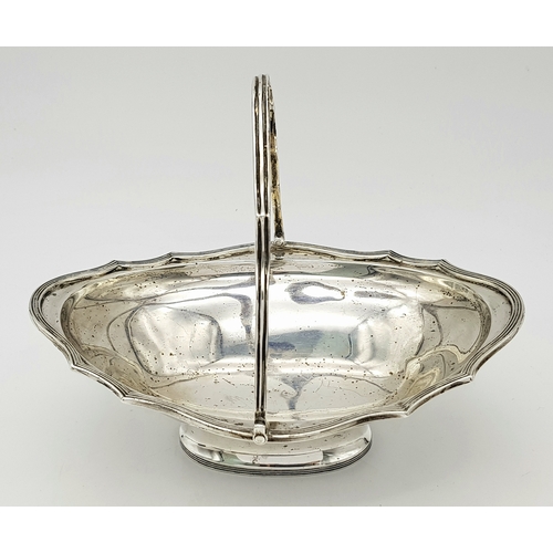 136 - An Antique Sterling Silver Serving Basket with Swing Handle.
Hallmarks for London 1907. 19cm length ... 
