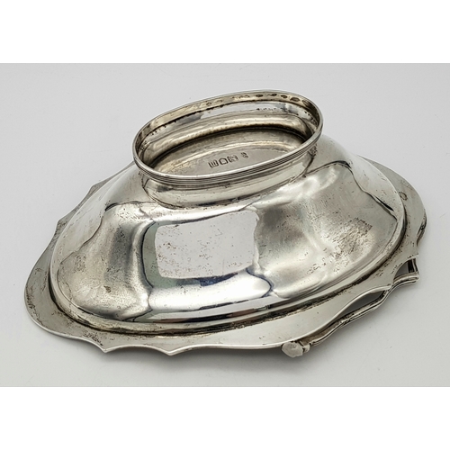 136 - An Antique Sterling Silver Serving Basket with Swing Handle.
Hallmarks for London 1907. 19cm length ... 