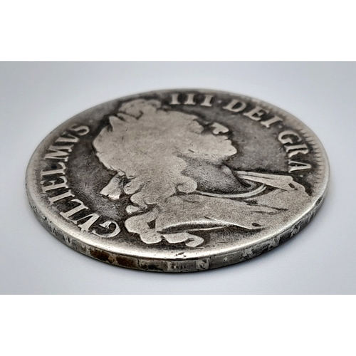 145 - A 1696 William III Silver Crown Coin. First bust, round collar. Obverse VF, Reverse F grade but plea... 