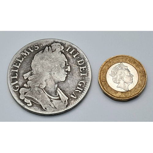 145 - A 1696 William III Silver Crown Coin. First bust, round collar. Obverse VF, Reverse F grade but plea... 