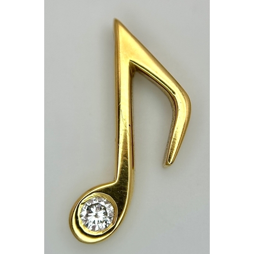 153 - An 18K Yellow Gold (tests as) and Diamond Set Musical Note Pendant. 2cm. 3.65g.