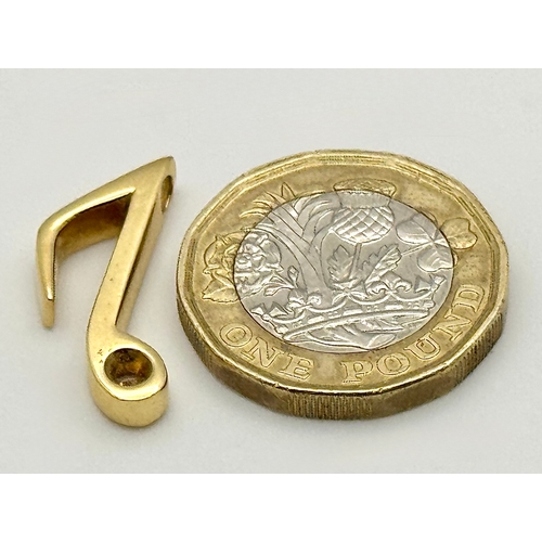 153 - An 18K Yellow Gold (tests as) and Diamond Set Musical Note Pendant. 2cm. 3.65g.