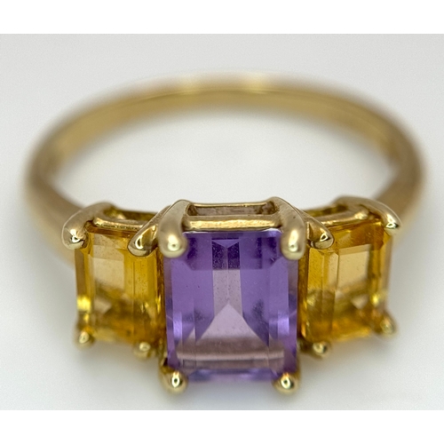 162 - A 9K Yellow Gold Citrine and Amethyst Ring. Emerald cuts. Size Q. 2.7g.