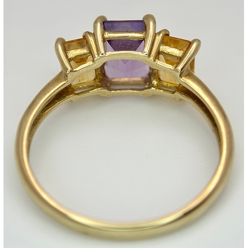 162 - A 9K Yellow Gold Citrine and Amethyst Ring. Emerald cuts. Size Q. 2.7g.