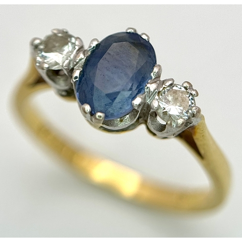 176 - A Gorgeous 18K Yellow Gold Sapphire and Diamond Ring. Oval cut pale blue 0.65ct sapphire with a 0.15... 