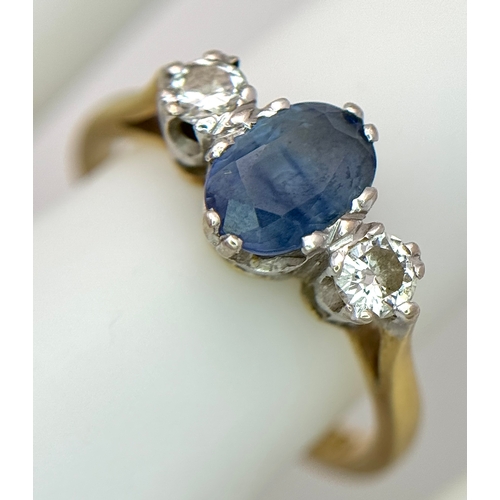 176 - A Gorgeous 18K Yellow Gold Sapphire and Diamond Ring. Oval cut pale blue 0.65ct sapphire with a 0.15... 
