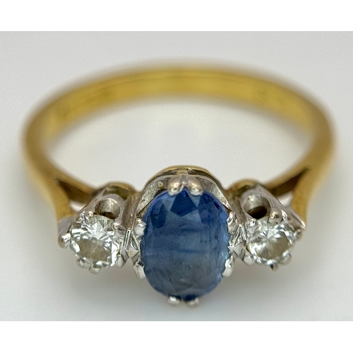 176 - A Gorgeous 18K Yellow Gold Sapphire and Diamond Ring. Oval cut pale blue 0.65ct sapphire with a 0.15... 