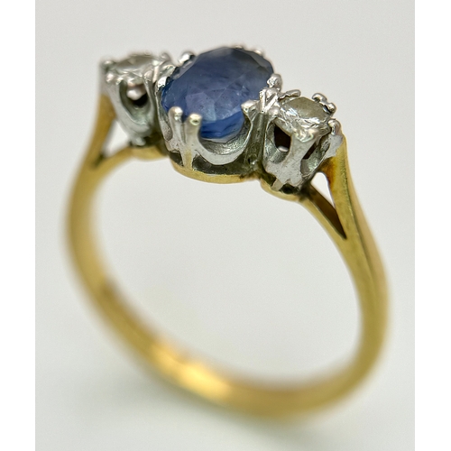 176 - A Gorgeous 18K Yellow Gold Sapphire and Diamond Ring. Oval cut pale blue 0.65ct sapphire with a 0.15... 
