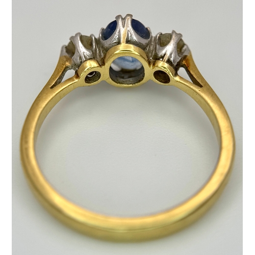 176 - A Gorgeous 18K Yellow Gold Sapphire and Diamond Ring. Oval cut pale blue 0.65ct sapphire with a 0.15... 