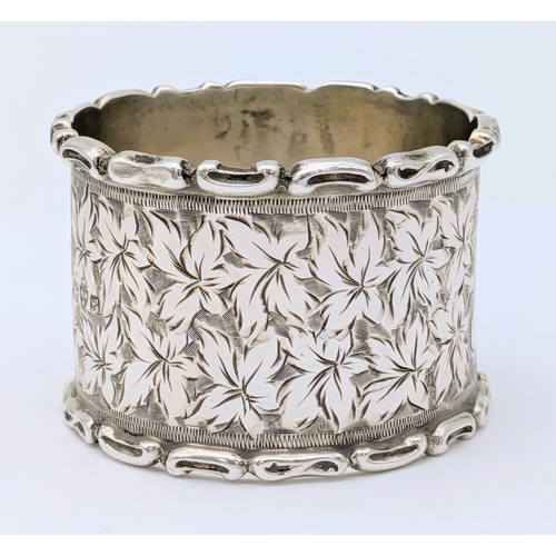 401 - An Antique Sterling Silver Napkin Ring with Leaf Engravings. Hallmarked Chester 1907. Weight 27.50g.... 
