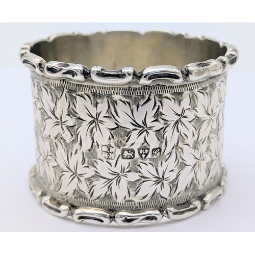 401 - An Antique Sterling Silver Napkin Ring with Leaf Engravings. Hallmarked Chester 1907. Weight 27.50g.... 