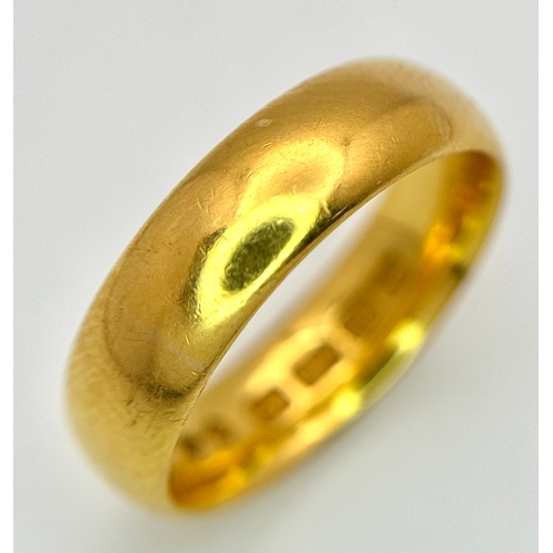 129 - A 22K Yellow Gold Band Ring. 6mm width. Full UK hallmarks. Size M. 6.84g.