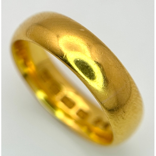 129 - A 22K Yellow Gold Band Ring. 6mm width. Full UK hallmarks. Size M. 6.84g.