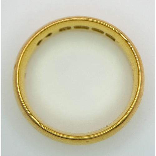 129 - A 22K Yellow Gold Band Ring. 6mm width. Full UK hallmarks. Size M. 6.84g.