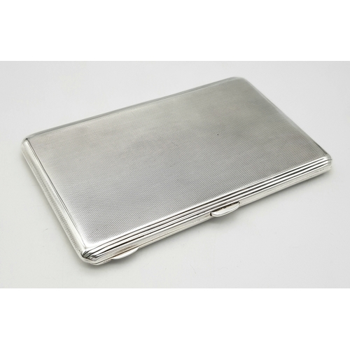 181 - A 1937 Sterling Silver Large Cigarette Case. Machine tooled decoration. In very good condition for i... 