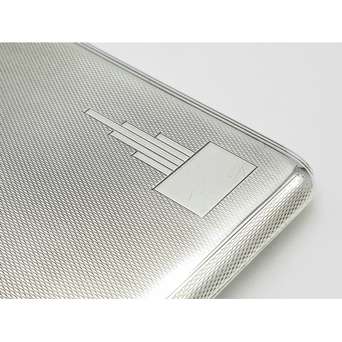 181 - A 1937 Sterling Silver Large Cigarette Case. Machine tooled decoration. In very good condition for i... 