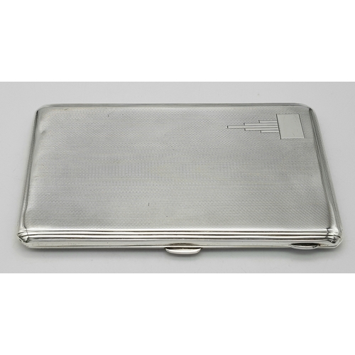 181 - A 1937 Sterling Silver Large Cigarette Case. Machine tooled decoration. In very good condition for i... 