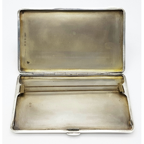 181 - A 1937 Sterling Silver Large Cigarette Case. Machine tooled decoration. In very good condition for i... 