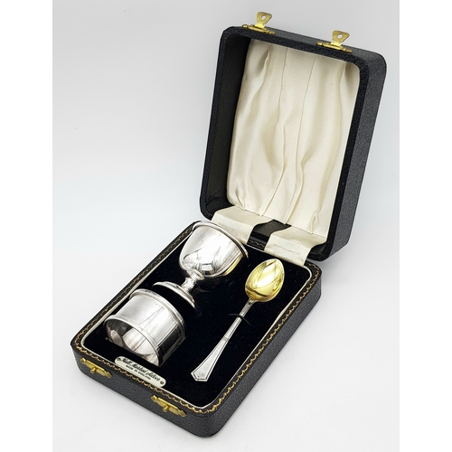 419 - A Vintage Sterling Silver Three Piece Christening Set. Consisting of egg cup, spoon and napkin ring.... 