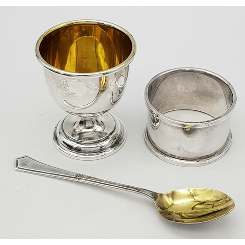 419 - A Vintage Sterling Silver Three Piece Christening Set. Consisting of egg cup, spoon and napkin ring.... 