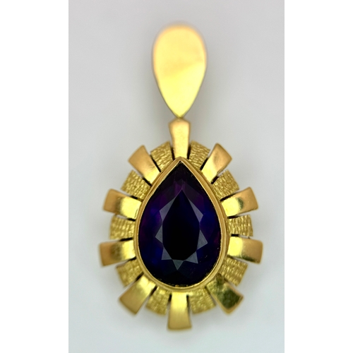 150 - An 18K Yellow Gold, Amethyst Pendant and Ring Set. An oval and pear cut centre stone - 4ctw set in a... 