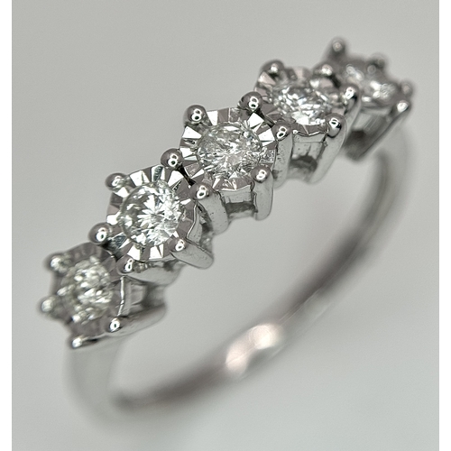1263 - A 9K White Gold Five Stone Diamond Ring. Size O. 2.7g. NL16/11206.