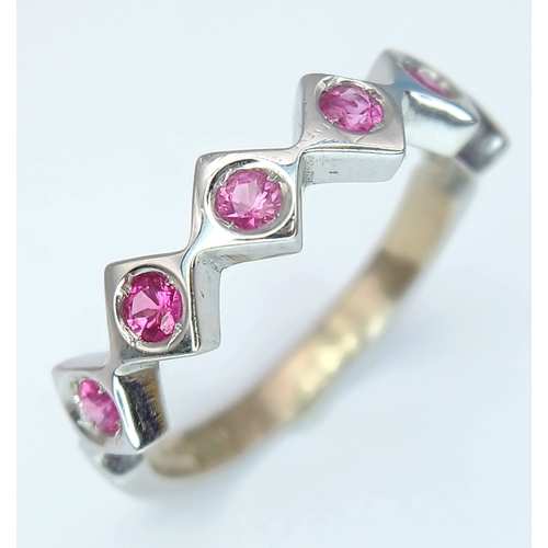 132 - An 18K White Gold, Ruby Set, Zig Zag Ring. 2.8G, Size L. Tan 6013