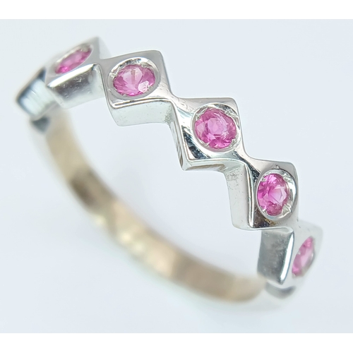 132 - An 18K White Gold, Ruby Set, Zig Zag Ring. 2.8G, Size L. Tan 6013