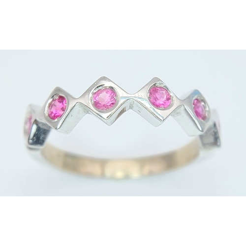 132 - An 18K White Gold, Ruby Set, Zig Zag Ring. 2.8G, Size L. Tan 6013