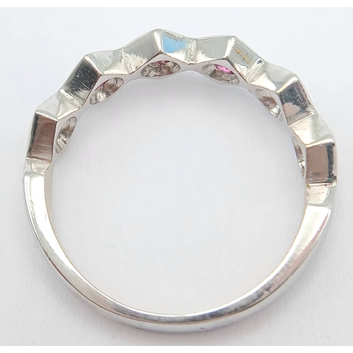 132 - An 18K White Gold, Ruby Set, Zig Zag Ring. 2.8G, Size L. Tan 6013