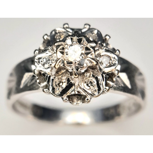 205 - A 18k white gold diamond engraved ring, 0.21ct diamond weight, 4.1g total weight, ring size O. Ref: ... 