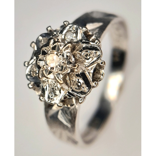 205 - A 18k white gold diamond engraved ring, 0.21ct diamond weight, 4.1g total weight, ring size O. Ref: ... 