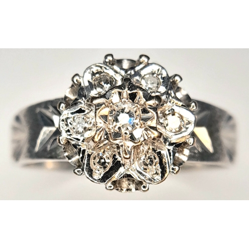 205 - A 18k white gold diamond engraved ring, 0.21ct diamond weight, 4.1g total weight, ring size O. Ref: ... 