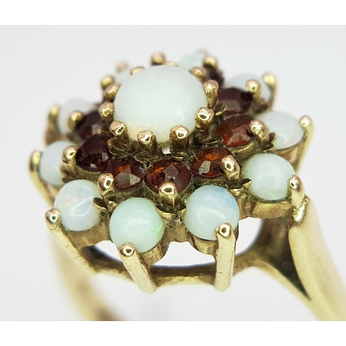 219 - A 9k yellow gold garnet and opal cluster ring, 0.30ct ruby weight, 4g total weight, ring size Q. Ref... 