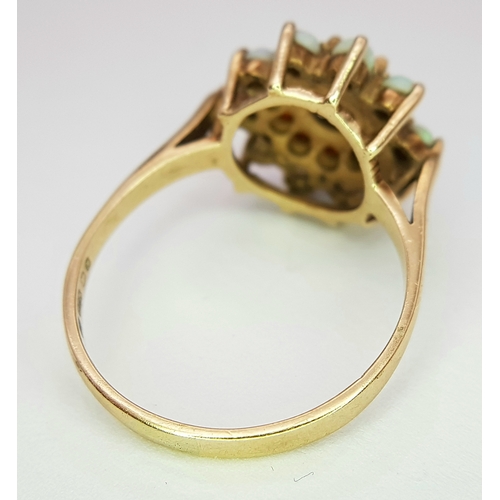 219 - A 9k yellow gold garnet and opal cluster ring, 0.30ct ruby weight, 4g total weight, ring size Q. Ref... 