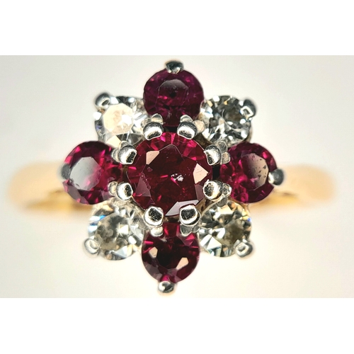 223 - An 18K Yellow Gold And Platinum, Vintage, Diamond And Ruby Set Cluster Ring. 2.1G, Size J. Sc 6052