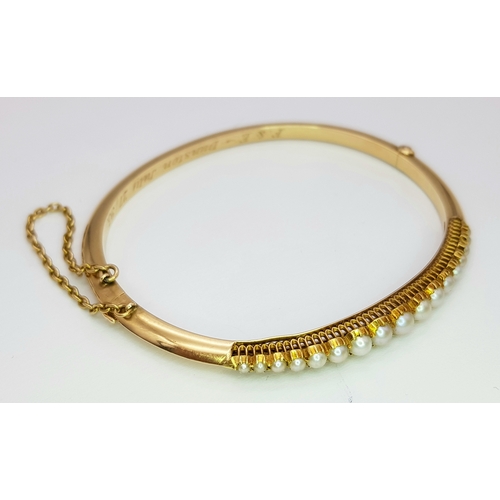 226 - A 14k yellow gold pearl bangle, 9.8g total weight, 6cm diameter. Ref: SH2520I