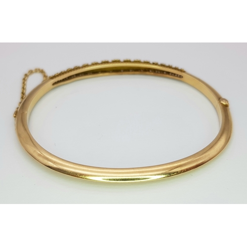 226 - A 14k yellow gold pearl bangle, 9.8g total weight, 6cm diameter. Ref: SH2520I