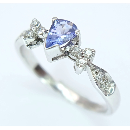 230 - An 18K White Gold, Diamond And Tanzanite Ring. 2.4G, Size M/N. Sc 6053