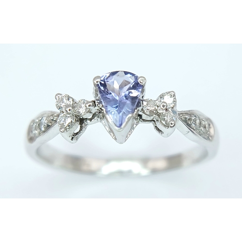 230 - An 18K White Gold, Diamond And Tanzanite Ring. 2.4G, Size M/N. Sc 6053