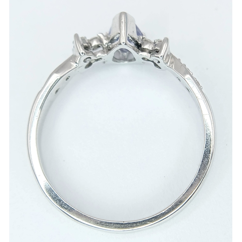 230 - An 18K White Gold, Diamond And Tanzanite Ring. 2.4G, Size M/N. Sc 6053