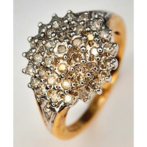 376 - A 9K Yellow Gold, Diamond Set Cluster Ring. 0.25Tcw, 2.7G, Size I. Sc 6005