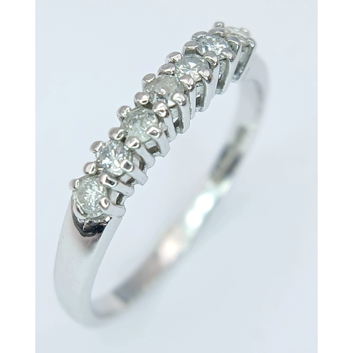412 - A 9K White Gold, Diamond Set, 7 Stone Ring. 0.15Tcw, 1.5G, Size N. Sc 6012